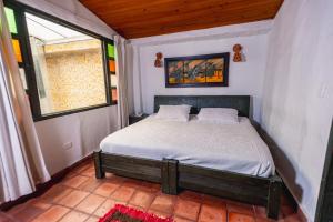 Postel nebo postele na pokoji v ubytování HOTEL COMPOSTELLA