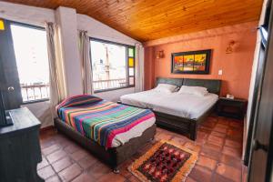 Postel nebo postele na pokoji v ubytování HOTEL COMPOSTELLA