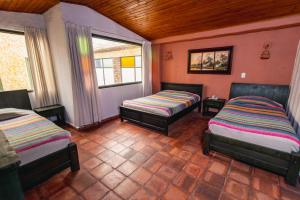 Postel nebo postele na pokoji v ubytování HOTEL COMPOSTELLA