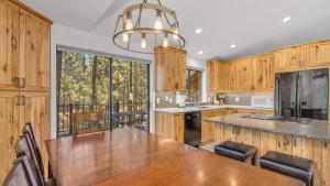 a kitchen with a table and a large window at Diamond Peak - Unit 20 in Sunriver