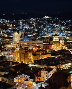 a view of a city at night with lights at Loft en Casa Jasso! in Guanajuato