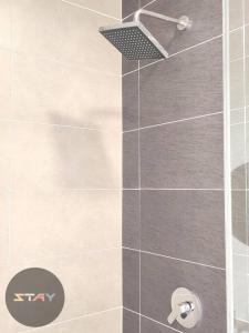 a shower stall with a glass door with a shower at DP Warm Sunshine Family Netflix Legoland By STAY in Iskandar Puteri