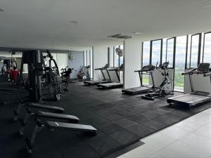 a gym with a bunch of treadmills and machines at The Podium, Kuching in Kuching