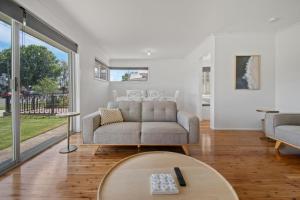 A seating area at Morgan Abode - Walk to CBD, Modern Escape