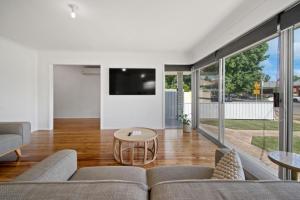A television and/or entertainment centre at Morgan Abode - Walk to CBD, Modern Escape