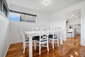 A kitchen or kitchenette at Morgan Abode - Walk to CBD, Modern Escape