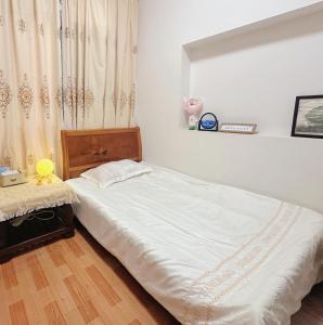 Ένα ή περισσότερα κρεβάτια σε δωμάτιο στο Yuanlaiju Inn
