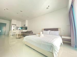 Foto Kuala Lumpuris asuva majutusasutuse SUNU温馨大床房KLcc双峰塔6分钟轻轨旁泳池 带阳台 galeriist