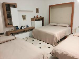 Postel nebo postele na pokoji v ubytování Laboratorio onirico