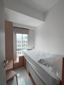 Ένα ή περισσότερα κρεβάτια σε δωμάτιο στο Bangulbobo 2br tower Ishikawa
