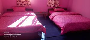 Postel nebo postele na pokoji v ubytování Saura Point Home Stay