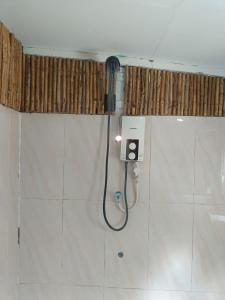 a shower in a bathroom with a hose at Sunny Bungalow in Koh Rong Sanloem