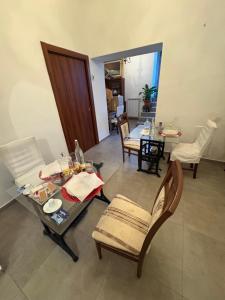 a living room with a table and chairs and a dining room at Borgo Scorciarini B&B in Piedimonte dʼAlife