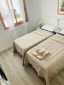 A bed or beds in a room at Sunny MASPALOMAS