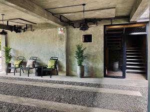 a group of chairs sitting on a patio at 518Hotel in San Josef