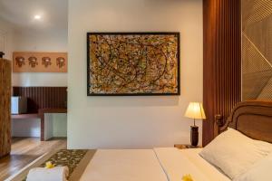 Postel nebo postele na pokoji v ubytování Kausala Bisma Ubud