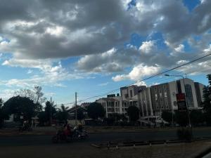 a view of a street with buildings and clouds at KHAL HOST HUB in Nairobi