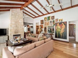 a living room with a couch and a fireplace at Orchard Homestead Countryside Retreat in Yallingup Siding