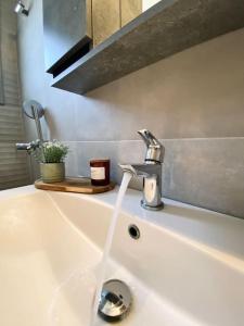 a kitchen sink with a faucet on top of it at Artemonas White Escape in Sifnos