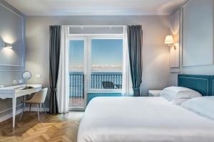 Cama ou camas em um quarto em Imperial Hotel Tramontano