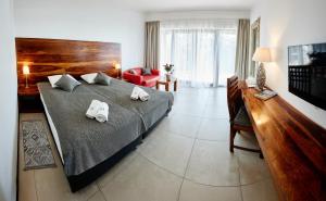 Postel nebo postele na pokoji v ubytování M Club Hotel | Lubie Resort
