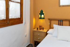 Posteľ alebo postele v izbe v ubytovaní Frente a la Alhambra
