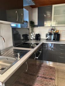 a kitchen with a sink and a counter top at Casa Dora in Ferro