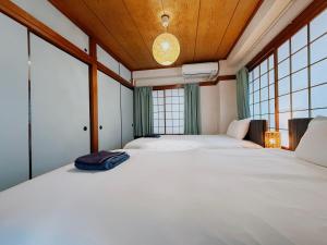 Katil atau katil-katil dalam bilik di Tokyo Shinjuku Waseda House新宿早稲田