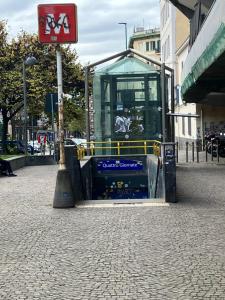 a building on a street with a sign on it at Rosemary s House Napoli Vomero Private Parking in Naples