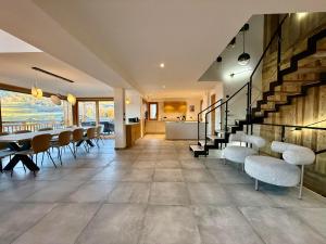 a dining room with a table and chairs at Chalet Petit Val in Combloux