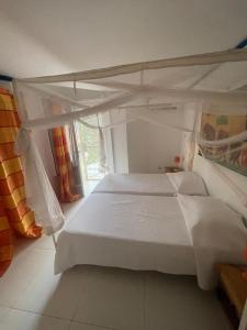 a bedroom with two bunk beds in a room at Teranga saly senegal in Saly Portudal