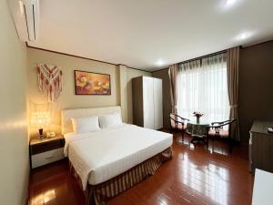 Postel nebo postele na pokoji v ubytování La Palma - Garden Saigon Hotel Phu My Hung