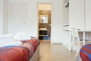 a living room with two beds and a table at CIVICO 15 BED BREAKFAST in Mercato San Severino