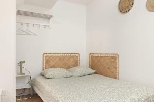 Ένα ή περισσότερα κρεβάτια σε δωμάτιο στο Studio cosy hyper-centre