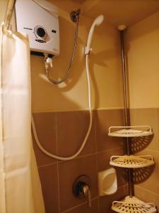 a shower in a bathroom with a shower at Avida Towers Riala, Tower 2 in Cebu City