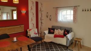 a living room with a couch and a table at Villa Maria in Sassnitz +54 photos