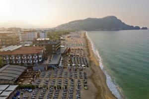 an aerial view of a beach with cars parked at Royalisa Palmiye Beach Hotel Adult Only in Alanya