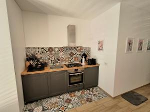Kuchyň nebo kuchyňský kout v ubytování Apartment near to Como - Donkey's House