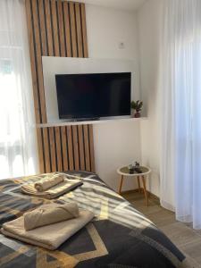 Posteľ alebo postele v izbe v ubytovaní Apartman Emilija