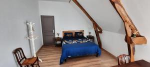 Posteľ alebo postele v izbe v ubytovaní La Ferme aux Fleurs