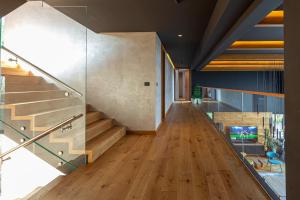 a hallway of a house with wooden floors and stairs at Villa Bella in Sarajevo