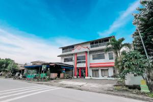 a building on the side of a street at Scala Inn By Helocus in Medan