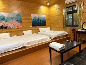 Letto o letti in una camera di He Ya Leisure Land B&B