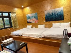 Letto o letti in una camera di He Ya Leisure Land B&B