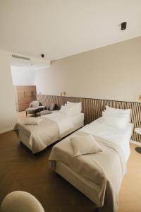 Katil atau katil-katil dalam bilik di Hotel Flaneur