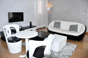 Televiisor ja/või meelelahutuskeskus majutusasutuses Residence SCI ABBAS