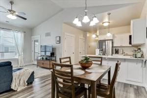 a kitchen and dining room with a table and chairs at FrontRunner Lehi Station Fully Equipped Kitchen in Lehi