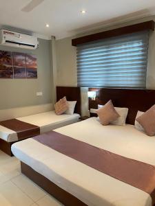 Postel nebo postele na pokoji v ubytování MercuryFM 101 Yarl Mercury Inn - Jaffna