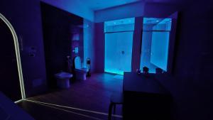 a bathroom with a toilet and a sink and a mirror at Etruria Apartments Salerno in Salerno +38 photos