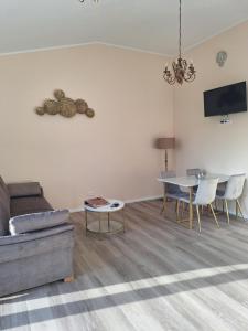 a living room with a couch and a table at Villa Rustica in Xanten